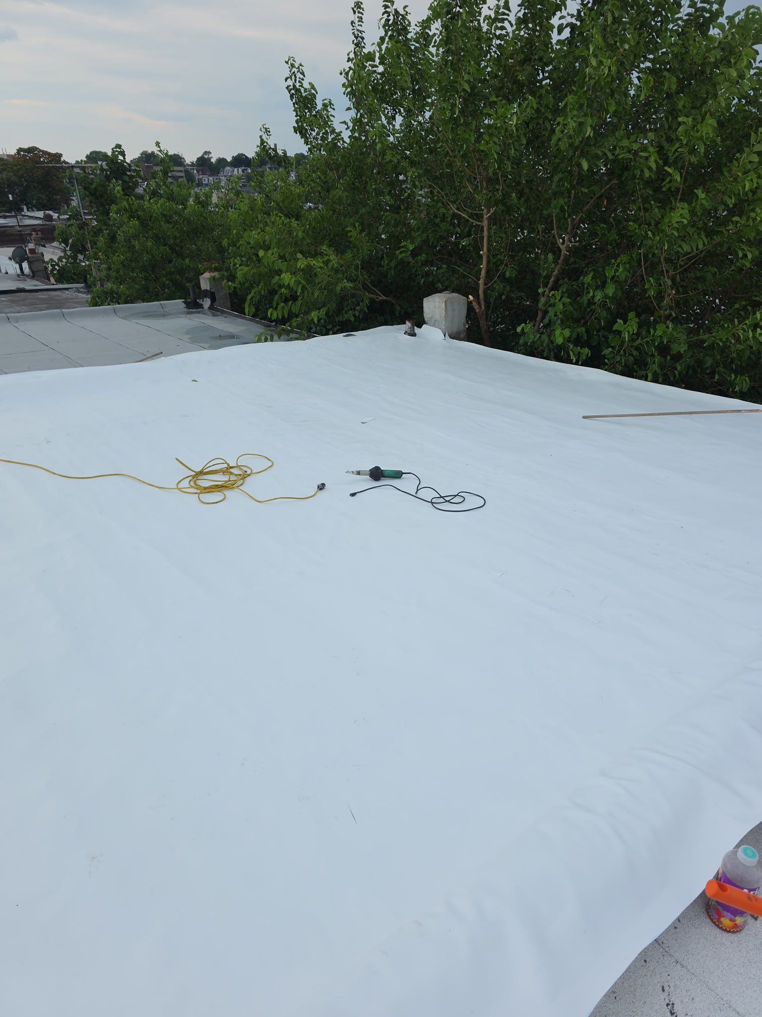 Commercial roof seam and pipe boot flashing detail